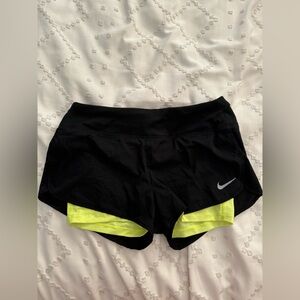 Nike Dri-Fit athletic shorts, black and neon green size M